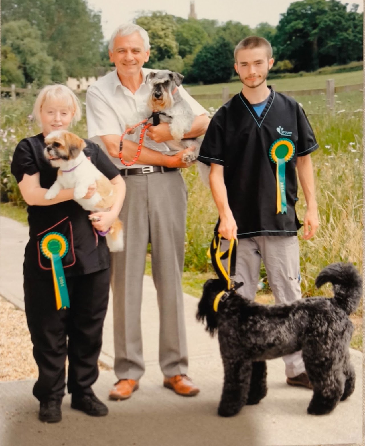 Tim with show rosettes outdoors